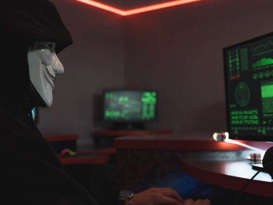 a person with mask using a computer