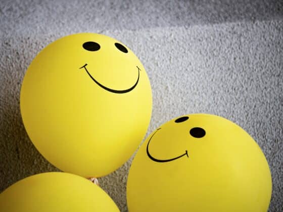 yellow smiley emoji on gray surface