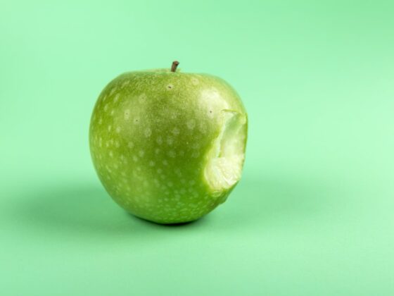 grannysmith apple with bite