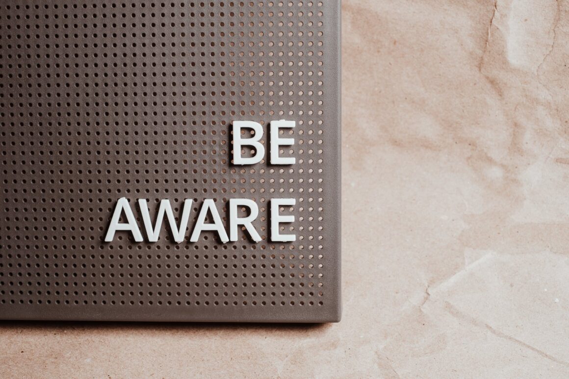 the phrase be aware on a pin board