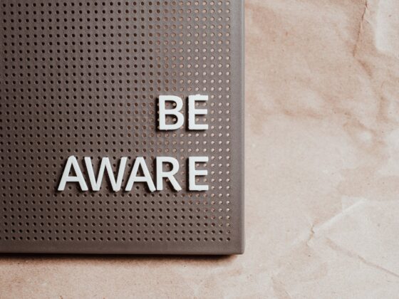 the phrase be aware on a pin board