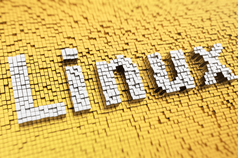 Un texte Linux en 3D sur un fond jaune