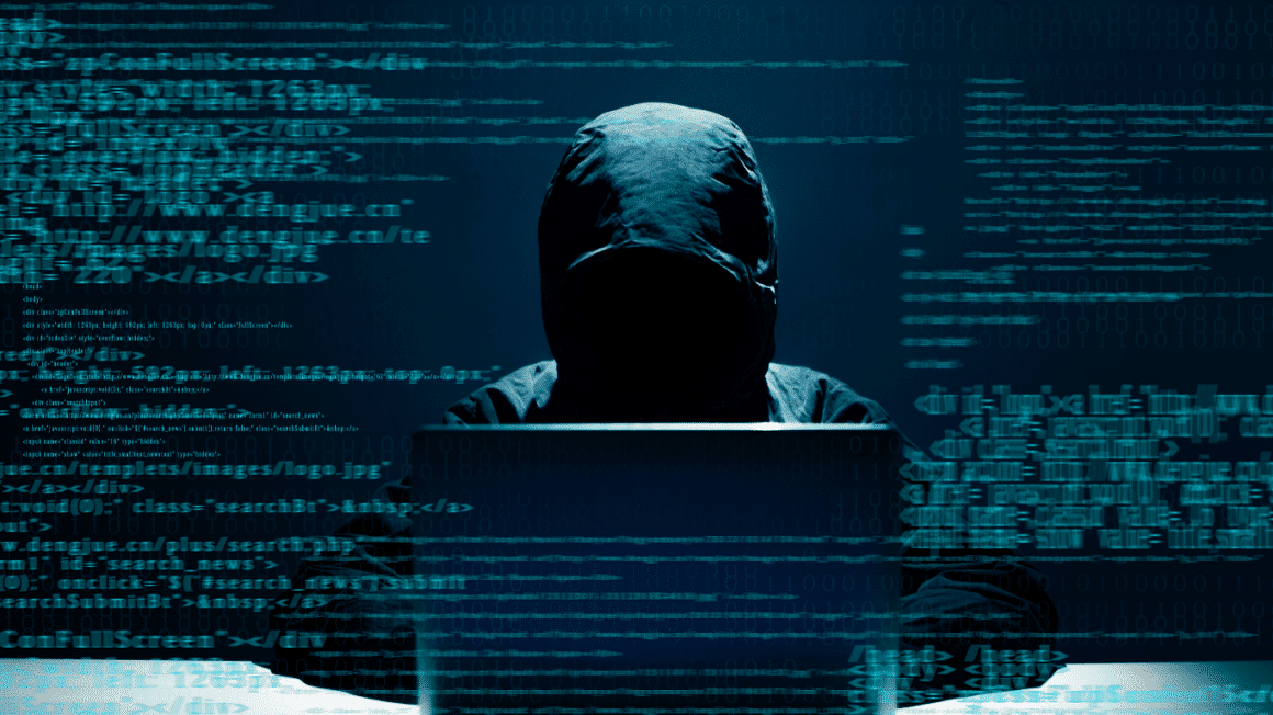 Un hacker avec un arriere plan flou de code
