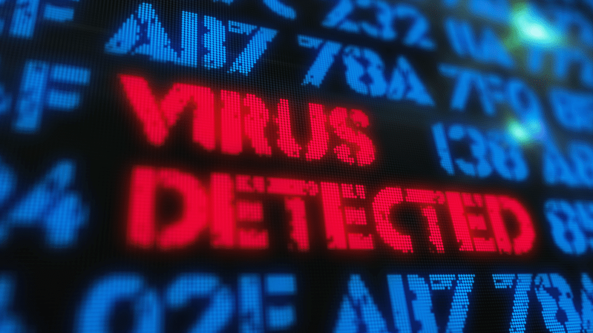 Un écran noir affichant en couleur Alerte virus