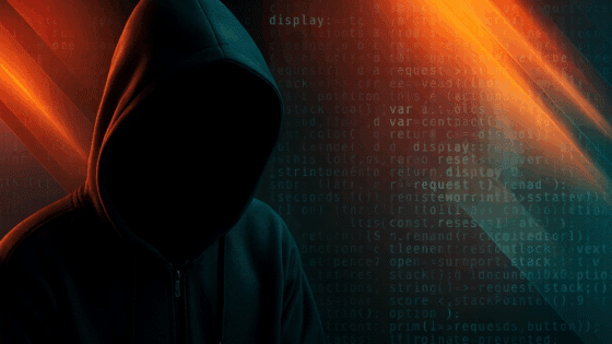 Silhouette sombre d’un individu portant une capuche, symbolisant un hacker, sur fond de code informatique et de lumières rouges et bleues, représentant une cyberattaque ou une activité de piratage.