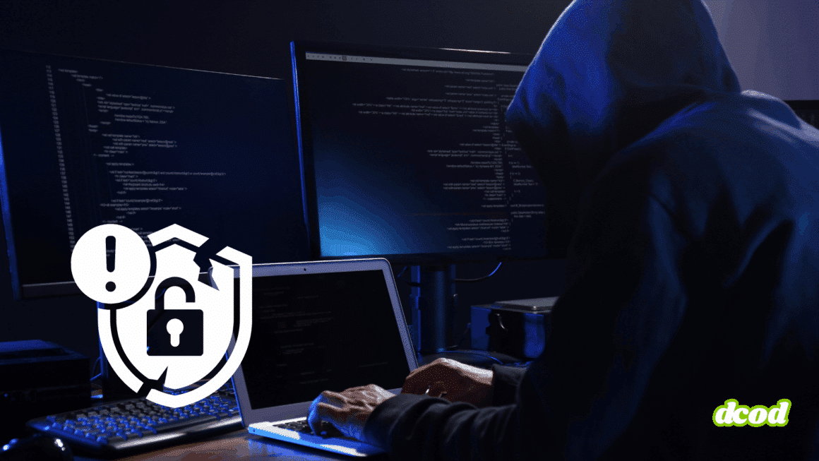Personne portant un sweat à capuche devant plusieurs écrans affichant du code, représentant une cyberattaque en cours, avec une icône de sécurité cassée en surimpression.
