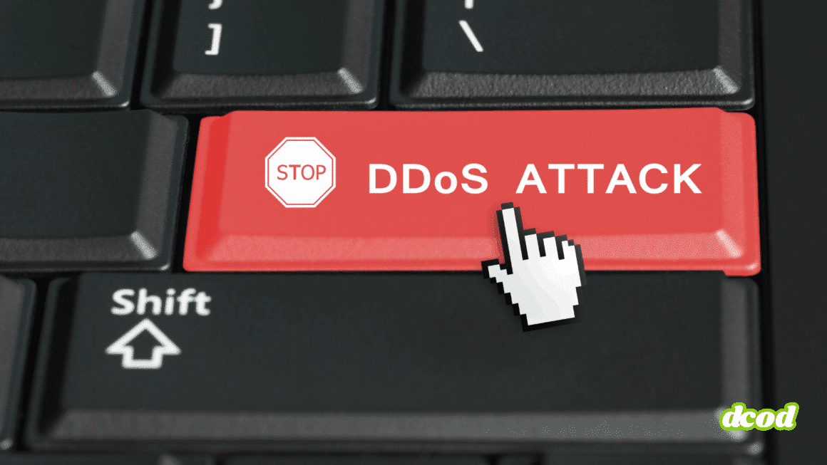 Touche rouge d’un clavier d’ordinateur portant l’inscription « STOP DDoS ATTACK » avec un curseur en forme de main, symbolisant l’interruption d’une attaque par déni de service distribué (DDoS)