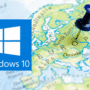 Logo de Windows 10 superposé sur une carte de l’Europe avec une punaise bleue plantée au centre du continent, illustrant le déploiement du système d’exploitation en Europe.