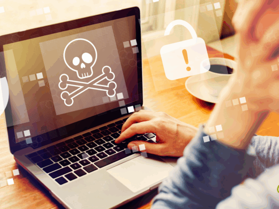 Une personne devant un ordinateur portable dont l’écran affiche une icône de tête de mort symbolisant un malware ou une cyberattaque, avec des pictogrammes d’alerte en surimpression, illustrant un problème de sécurité informatique.