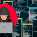 Illustration d’un hacker encapuchonné utilisant un ordinateur, sur fond de schéma de code et de bases de données, représentant une attaque informatique et les risques de cybersécurité