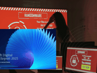Rançongiciels et extorsion : plus de 50 % des cyberattaques motivées par l’argent 7 Une femme observe un écran rouge affichant un message de ransomware, entourée d’ordinateurs compromis, avec en surimpression la couverture du rapport « Microsoft Digital Defense Report 2025 » sur la cybersécurité.