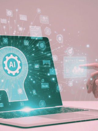 Une main tendue interagit avec un écran d’ordinateur portable affichant une silhouette de tête humaine contenant une roue dentée marquée « AI », symbolisant l’intelligence artificielle. Des icônes technologiques flottent autour, illustrant les connexions numériques et l’innovation.