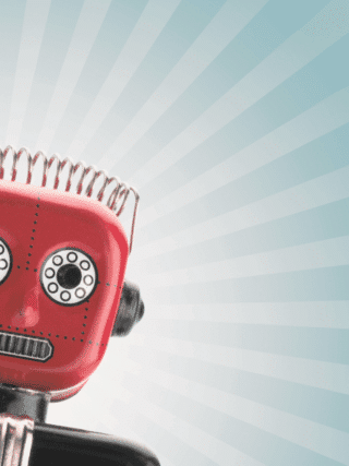 Petit robot rouge au style vintage, incliné vers la gauche, sur fond bleu clair avec des rayons lumineux stylisés.