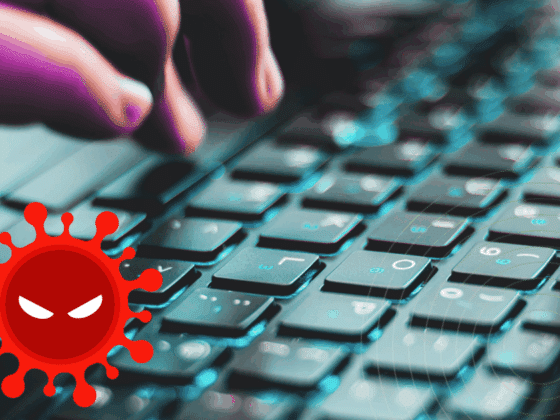 Gros plan sur une main tapant sur un clavier d’ordinateur, avec en surimpression une icône rouge représentant un virus informatique menaçant.