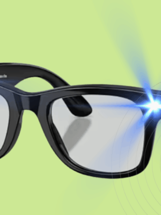 Paire de lunettes noires au style classique projetant des faisceaux lumineux bleus depuis les coins supérieurs, sur fond vert clair, évoquant une technologie avancée ou un effet visuel humoristique.