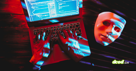 Illustration de cybersécurité montrant un hacker tapant sur un ordinateur portable avec un masque blanc symbolisant l'anonymat, illustrant comment les arnaques dopées à l'IA permettent au crime de changer d'échelle à travers le code informatique et les fraudes numériques.