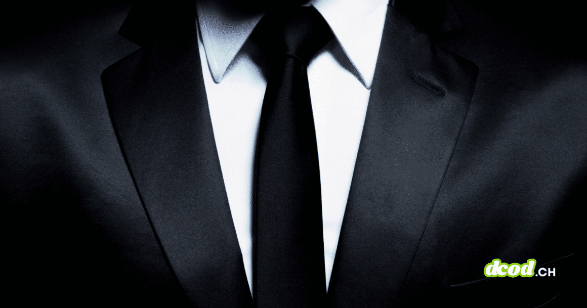 Gros plan d'un costume élégant et d'une cravate noire, illustrant l'ascension du ransomware The Gentlemen qui bouscule le marché du cybercrime avec son split de rançon inédit à 90%.