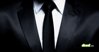 Gros plan d'un costume élégant et d'une cravate noire, illustrant l'ascension du ransomware The Gentlemen qui bouscule le marché du cybercrime avec son split de rançon inédit à 90%.