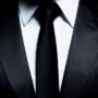 Gros plan d'un costume élégant et d'une cravate noire, illustrant l'ascension du ransomware The Gentlemen qui bouscule le marché du cybercrime avec son split de rançon inédit à 90%.