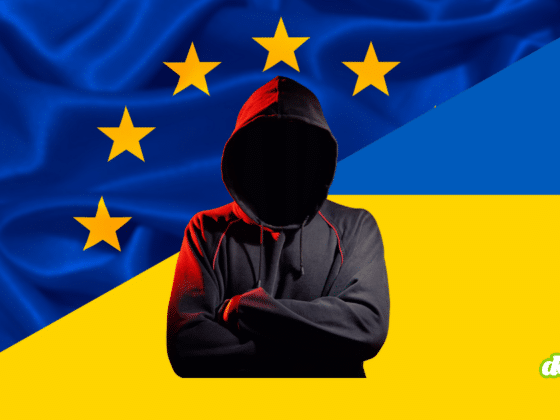Silhouette anonyme en sweat à capuche noir devant les drapeaux de l'UE et de l'Ukraine, illustrant l'intégration de Kiev au bouclier d'urgence et à la réserve cyber européenne.