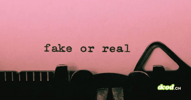 Gros plan sur une machine à écrire affichant les mots "fake or real" dactylographiés sur une feuille rose.