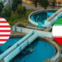 Bassin de réseau de distribution d'eau potable avec macarons des drapeaux USA et Iran illustrant les cyberattaques sur les infrastructures.
