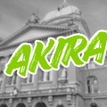 Palais fédéral suisse en noir et blanc barré du nom Akira en lettres vertes, illustrant la cyberattaque contre les données d'employés fédéraux.