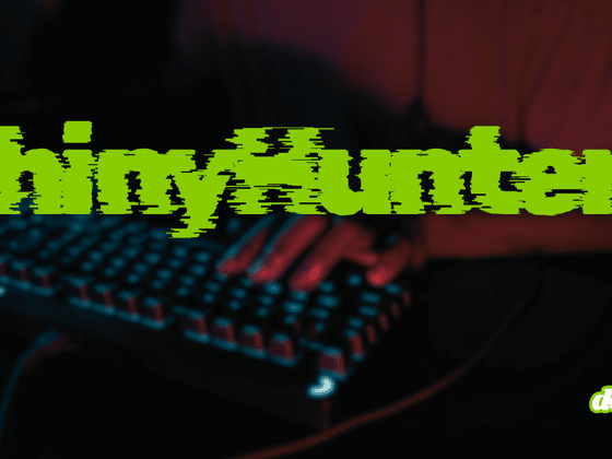 Mains d'un informaticien tapant sur un clavier rétroéclairé dans la pénombre, avec le nom du groupe cybercriminel ShinyHunters inscrit en lettres vertes stylisées.